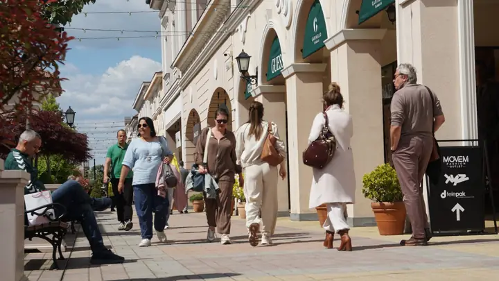 Shoppers walking through the outlet