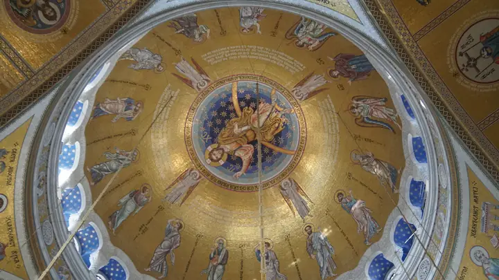 Golden mosaic dome inside Saint Sava Temple